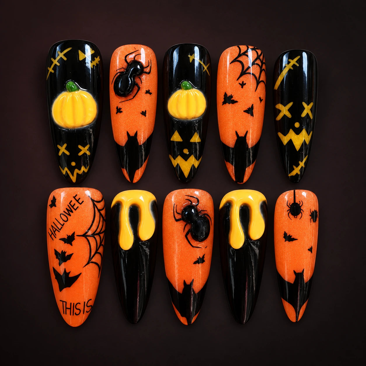 Orange and black pumpkin nails; AI-styled product photograph